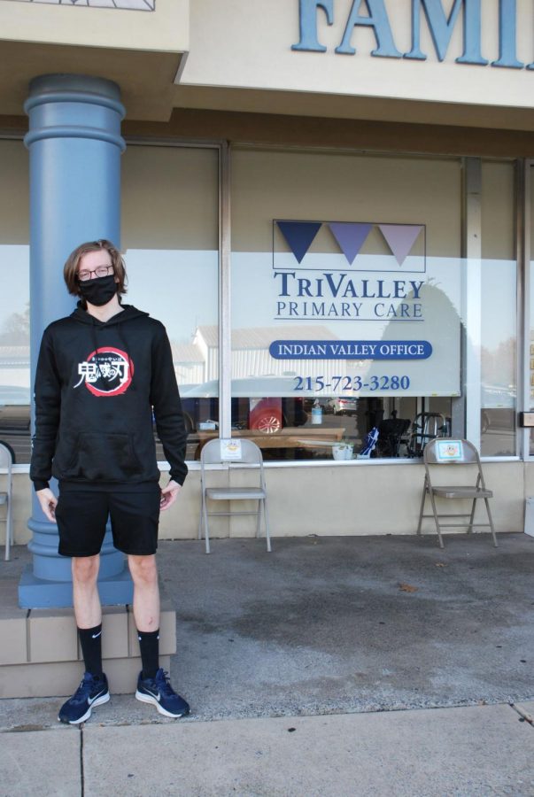 Waiting Safely… Junior Logan Ulmer waits outside of TriValley Primary Care wearing and mask to go into the primary care provider.