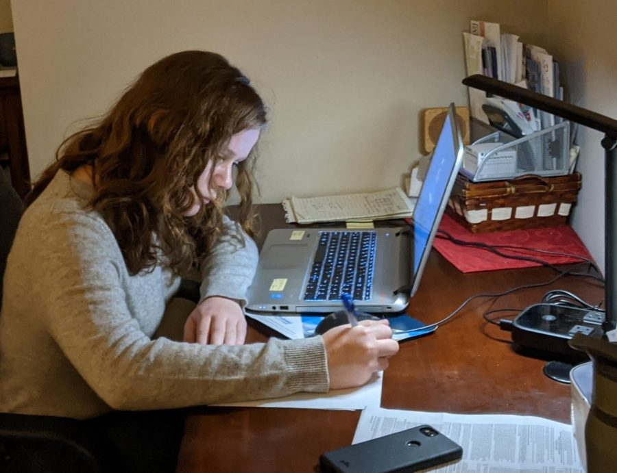 Preparing for class...senior Katelyn Schuchardt completes classwork in her home for the Souderton Area Online Academy. Schuchardt is a fully virtual student this year. 
Photo reprinted with permission from Katelyn Schuchardt
