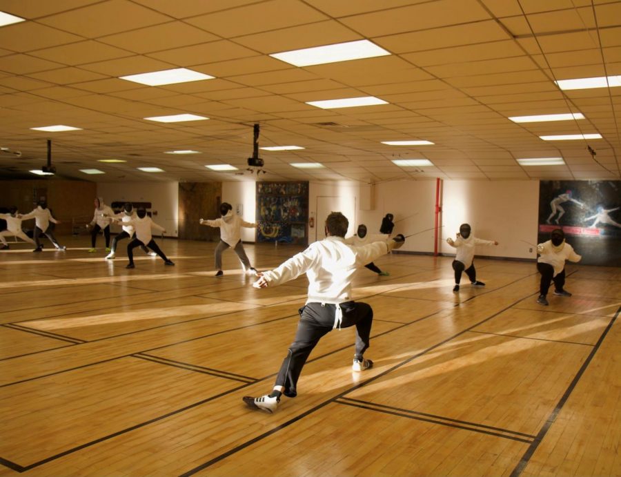 Taking+a+stab+at+fencing...The+fencing+club+is+warming+up+in+their+fencing+gear.+The+clubs+fencing+equipment+is+all+financed+by+En+Garde%21+Souderton.
