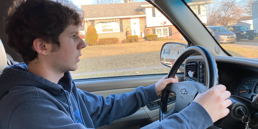 Staying focused...By paying attention to his surroundings, junior Nick Mancini navigates the road. Mancini has both hands on the wheel and both eyes on the road in order to be more alert. Arrowhead photo by Charlton Allen
