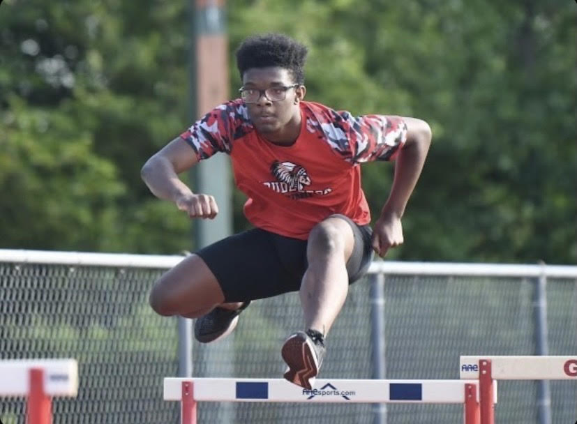 “Get out of your seat and jump around”...During a 2020 summer meet at the Olympic Club, junior Dekai Averett participates in a 110m hurdle run. Aside from the 110m hurdles, Averett also competes in a multitude of track events, including 300m hurdles, 200m, 400m and long jump. 