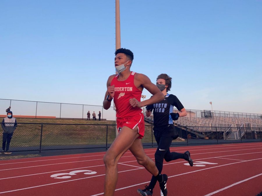 **Leading the pack...** *Running at the front of the field, junior Manny Rota-Talarico leads the boys 3000m run. Despite the cold winter weather the track team ran outdoor “polar bear” meets to abide by COVID-19 indoor gathering restrictions.*

*Arrowhead photo by Dekai Averett*