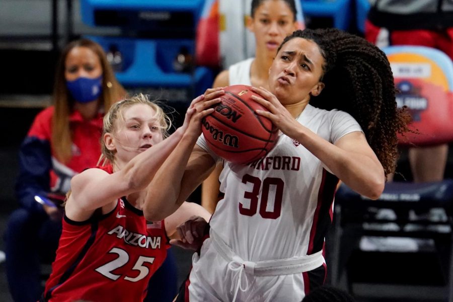 **Close call…***Fighting for the ball, Stanford guard Haley Jones (30) and Arizona forward Cate Reese (25) try to make the winning basket. With a score of 54-53, Stanford comes out on top as the March Madness champion. Photo by AP images photographer Eric Gay.*