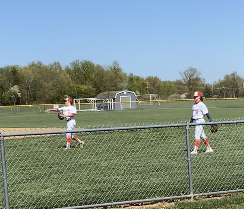 **Catch ya later…***Warming up for their game against Pennsbury high school. #1 Zach Crouthamel and #7 Matt Benner at the Harleysville baseball complex had a catch with their teammates.*
*Photo by Sophie Thom*
