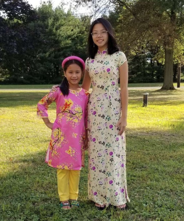 *Celebrating her Asian heritage…Sophomore Amy Tran and her younger sister Aryton wear the national traditional dress of Vietnam, the áo dài. Tran is still in touch with Vietnamese culture and traditions. Photo by Dung Pham*

