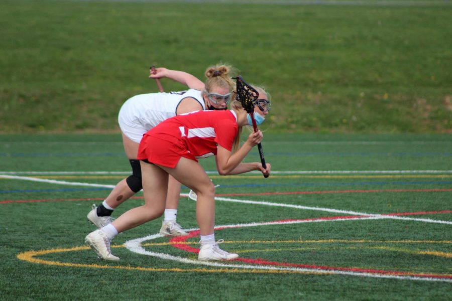 ***Catching up...**In a tight game against Plymouth Whitemarsh, freshman Avery Farina (right) sets up on the eight meter after being fouled.  The Souderton girls lacrosse team played PW on April 23 and it came down to the last few seconds for Souderton to come out on top, winning 10-9.  Photo by Arrowhead Jessica Ace.*