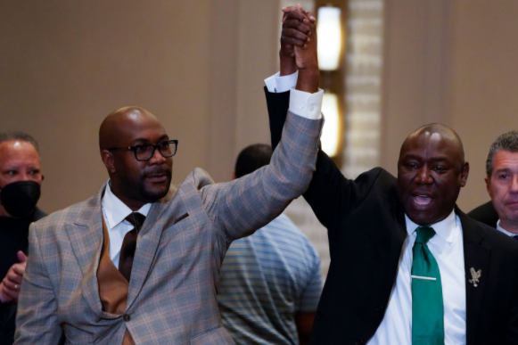**A sigh of relief...***Following the announcement that former police officer Derek Chauvin has been found guilty for the murder of African American George Floyd, brother of Floyd Philonise Floyd (left) and Attorney Ben Crump (right) celebrate Chauvin’s conviction on April 20 in Minneapolis, Minnesota. Many other Americans gathered on the streets throughout the country to rejoice in the guilty verdicts.*

*Photo by Julio Cortez*

