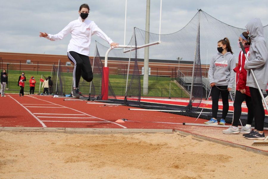 **Leaping into the win…***Diving into the sand during the long jump, sophomore Lauren McClure makes her jump towards gaining points for Souderton. The virtual track meet took place on April 22.*

*Arrowhead photo by AnnE Potter*