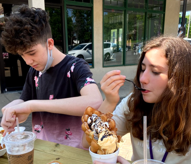 ***Waffly delicious…**Enjoying breakfast at The Crepe Place V-Dal in Harleysville, sophomore Gabe Heim (left) and junior Camille Schwabe chow down on specialty menu items. Schwabe ordered the s’mores bubble waffle. Arrowhead photo by Sophie Rodrique*