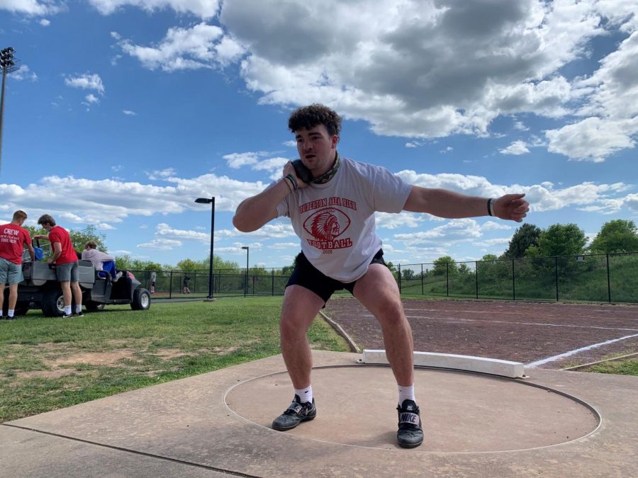 ***Intently focused...**Thinking about his throw, senior Aonghas Evanick prepares his throwing process to launch his shot. Evanick has been undefeated in two of his three events this season, and prepares for his college season next year.*