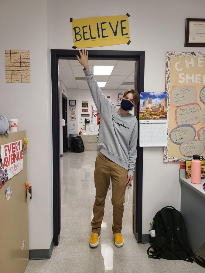 Believe in believe…During an October 9 Saturday layout session, Arrowhead staff writer Everett Self shows he believes by tapping his homemade “BELIEVE” sign from the hit series “Ted Lasso”. The sign represents believing in yourself and others, along with always trying your best.