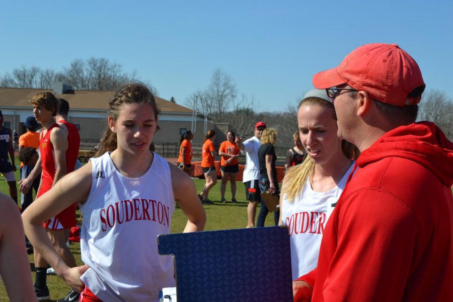 Post+meet+pep+talk...After+competing+in+the+4x400+meter+relay+at+the+2014+Viking+Invite+at+Perkiomen+Valley+High+School%2C+sprinter+Sue+Frustino+%28left%29+and+hurdler+Allison+Gallagher+receive+some+advice+and+motivation+from+track+coach+Mike+Feliciani.+Athletes+say+that+Feliciani%E2%80%99s+ability+to+support+and+inspire+is+something+they+will+remember.%0A