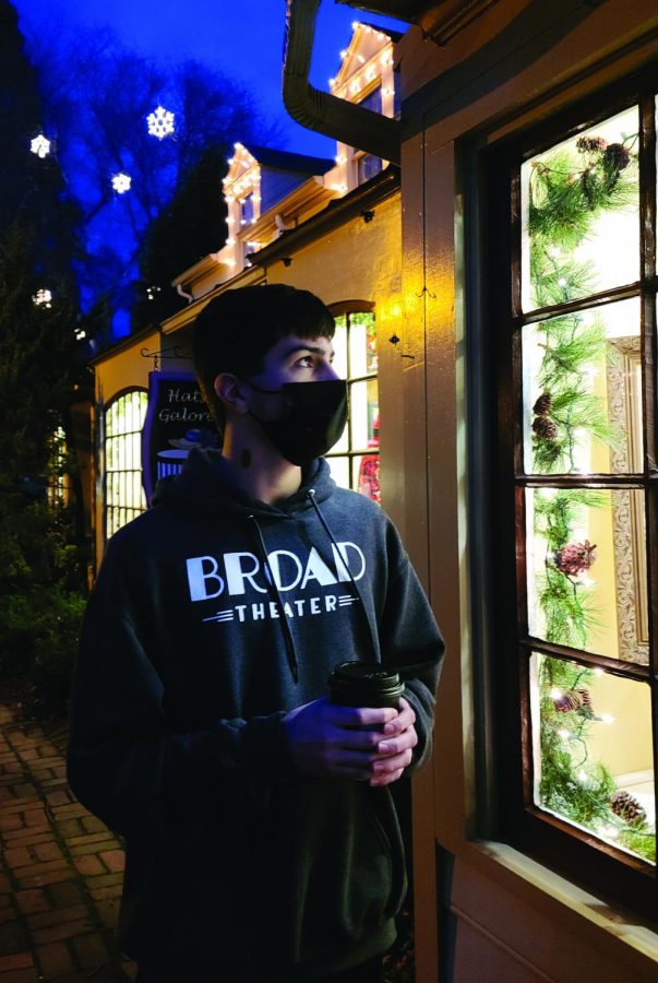 Happy for the holidays...Enjoying a hot chocolate, sophomore Nick Diamond observes Peddler’s Village holiday lights. On the first night of their “Merchants Open House,” the village turns on their outside holiday lights.