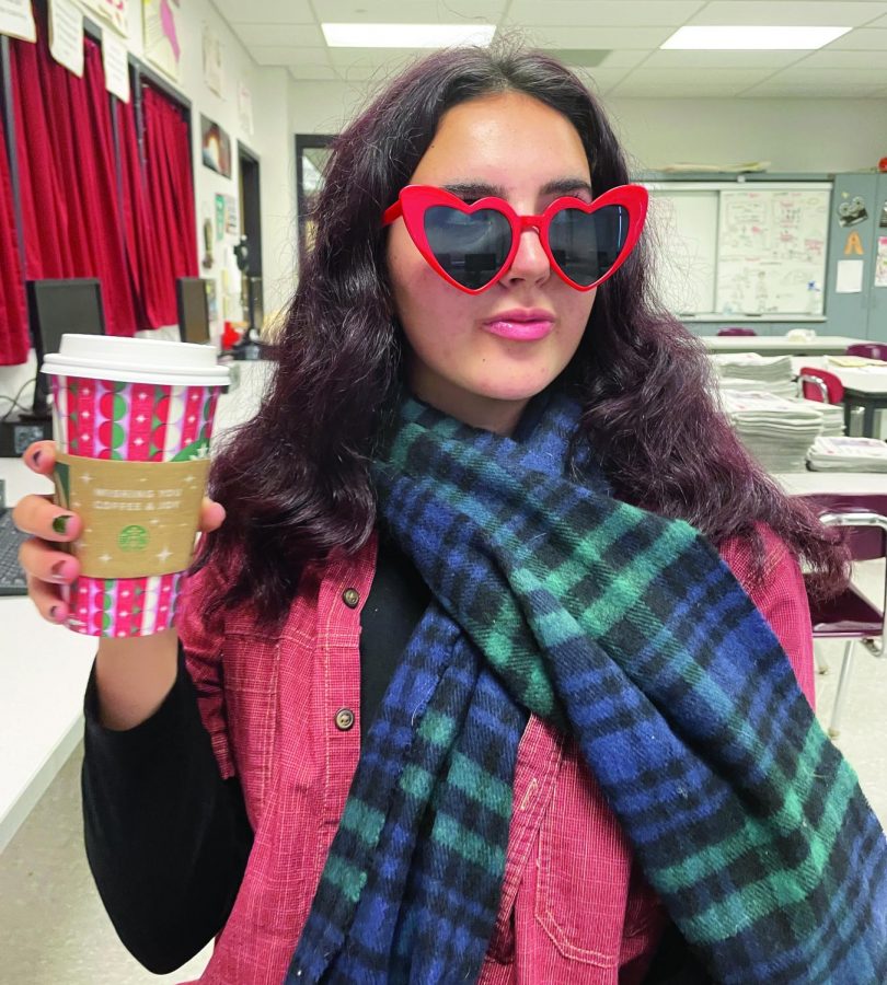 Got a lot of Starbucks lovers...Sipping Taylor’s Starbucks drink, senior Sophie Rodrique takes in the release of “Red (Taylor’s Version). The re-recorded album was released on November 12. 