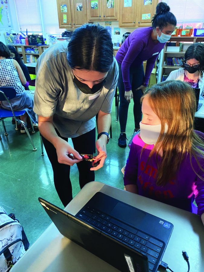 Technology of the future...While visiting the Souderton Charter School Collaborative on 
November 18, Teach Girls Tech Vice President Ava Beskar works with student Tessa Willouer on 
coding new and complex games using the micro:bit