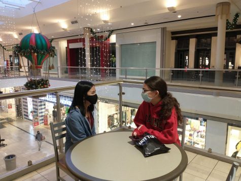 Shop and stop...Enjoying a few minutes of rest, juniors Amanda Do (left) and Emma Bolado take a pit stop after an hour of shopping for the holidays at the Montgomery Mall in North Wales, Pa. 