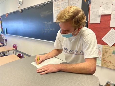 The most wonderful time of the year...Getting ready for Saint Nick, senior Preston Ziegenfuss writes up a Christmas list. The top item on Ziegenfuss’s list is a road bicycle because of his passion for bike riding.