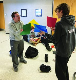 Colorful competition...Arguing over school subjects in correlation to colors, sophomores Ben Ekker (left) and Nathan Woodbury state their cases. The subjects of math, English, social studies and science are up for debate.