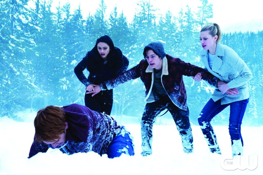 Breaking the ice… Attempting to save Cheryl from drowning, Archie breaks through the frozen Sweetwater River while Veronica (left), Jughead (middle) and Betty watch in horror. This scene, featured in the finale of Season 1, exemplifies the uniquely remarkable cinematography of season one.