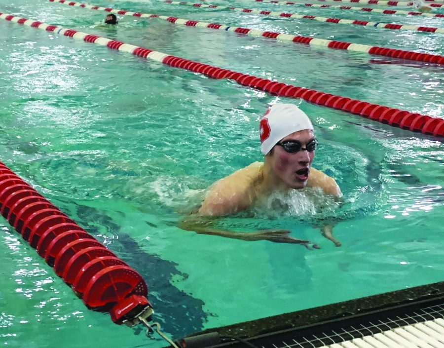 Just keep swimming…Gliding through the water in his butterfly race on December 22, sophomore Abraham Bleazard dominates the pool lane. Souderton Boys Swim Team won 120 to 63 during this meet against Hatboro-Horsham High School.