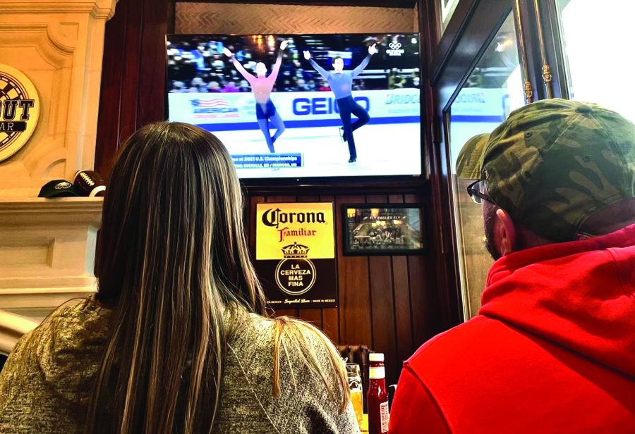 Winter watchers...Watching the Olympic channel at Timeout Sports Bar, Katie Townsend (left) and Brian Curry observe U.S. ice dancers Caroline Green and Michael Parsons compete at the 2022 Winter Olympics in Beijing, China.