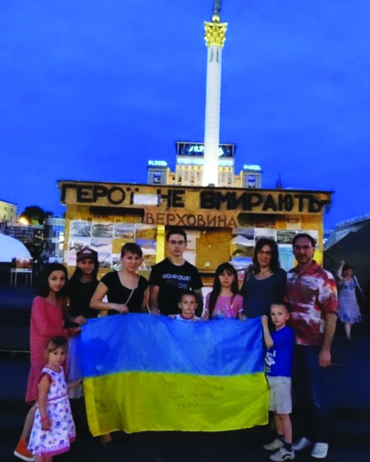 Heroes do not die...Standing in front of an Independence Square statue on Khreshchatyk Street, in Kyiv, Ukraine, Emily Murmylo (middle right in pink) and her family celebrate their Ukrainian heritage. Murmylo lived in Ukraine between 2012 and 2014, when this photo was taken.