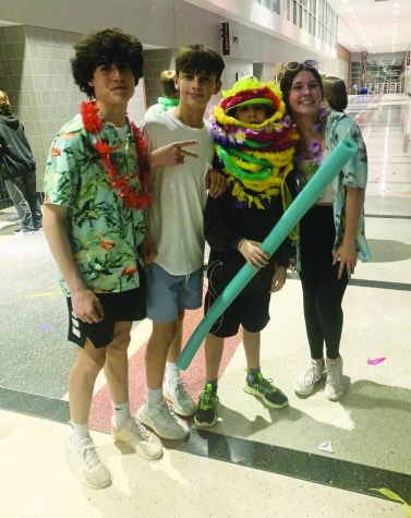 Making memories...Hanging out in the concourse, (from left) eighth-graders Timmy Meehan, Liam Shaw, Matthew Gerhart and Link Crew member Olivia Koch take a break from the dance floor at the Eighth Grade Mixer on May 6.