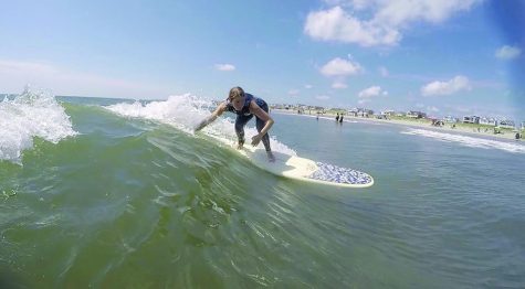 Kawabonga!...Catching a wave, senior Vanessa Morrison surfs off the coast of Ocean City, New Jersey. Morrison started teaching herself how to surf after initially being introduced to surfing by her grandparents.