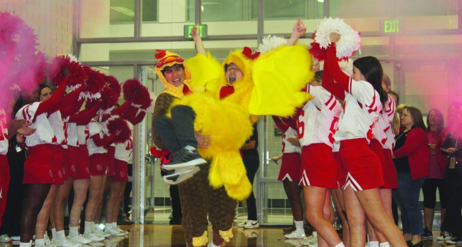 Not chickening out...Gearing up for the Wing Bowl, junior Jaden Knize (left) carries junior Zach Gross into the Wing Bowl competition. Students, teachers and administration cheered them on during the October 7 homecoming pep rally.
