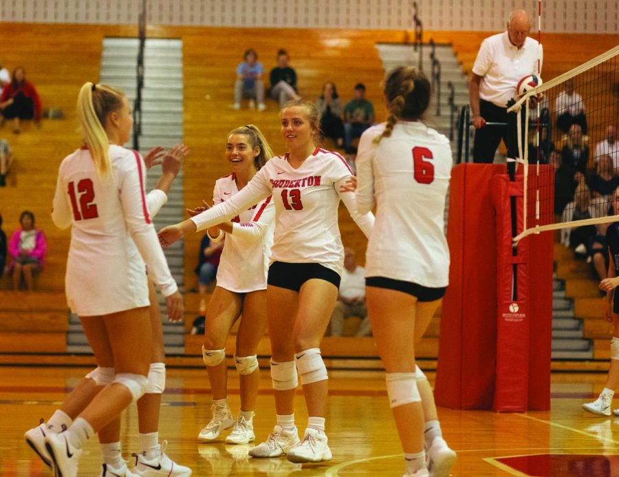 Arms open wide...Celebrating, junior McKenna Murawski (left) and sophomore Lauren Vince congratulate their fellow teamates after scoring in the first quarter during a September 22 match against Central Bucks South High School.