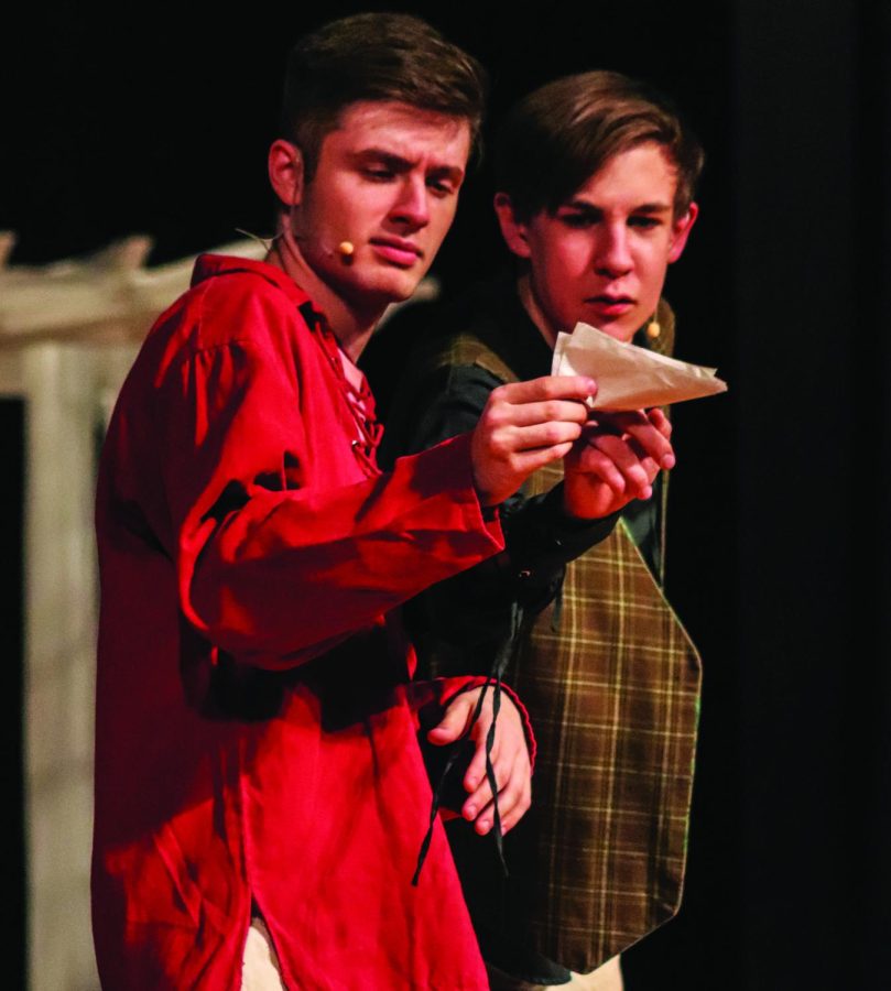 Acting for an audience…Embracing their roles, juniors Cayden Johnson (left) and Jackson Rohrbaugh read a letter during the fall play production of “Twelfth Night.” The pair played Sir Andrew Aguecheek and Sir Toby Belch.