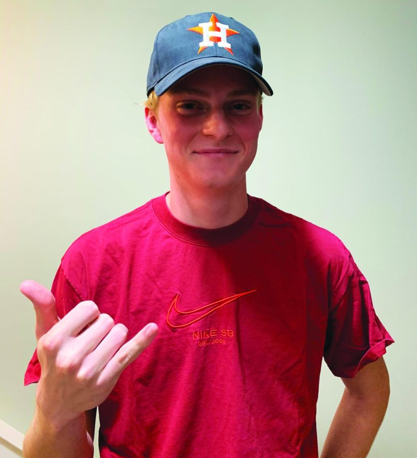Cap of shame…Smiling through the pain, Phillies sports fan Ryan Schewe shows off his Houston Astros baseball hat. After losing a bet on the outcome of the MLB world series, Schewe was forced to wear the emblem of his rival baseball team for a day.