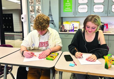 Frenchified fun...As they work on a French painting-inspired art activity, freshmen Aidan Golla (left) and Sophie Dubois enjoy time with friends. The activity helped them to learn more about French art while also having fun during the November 18 club meeting.
