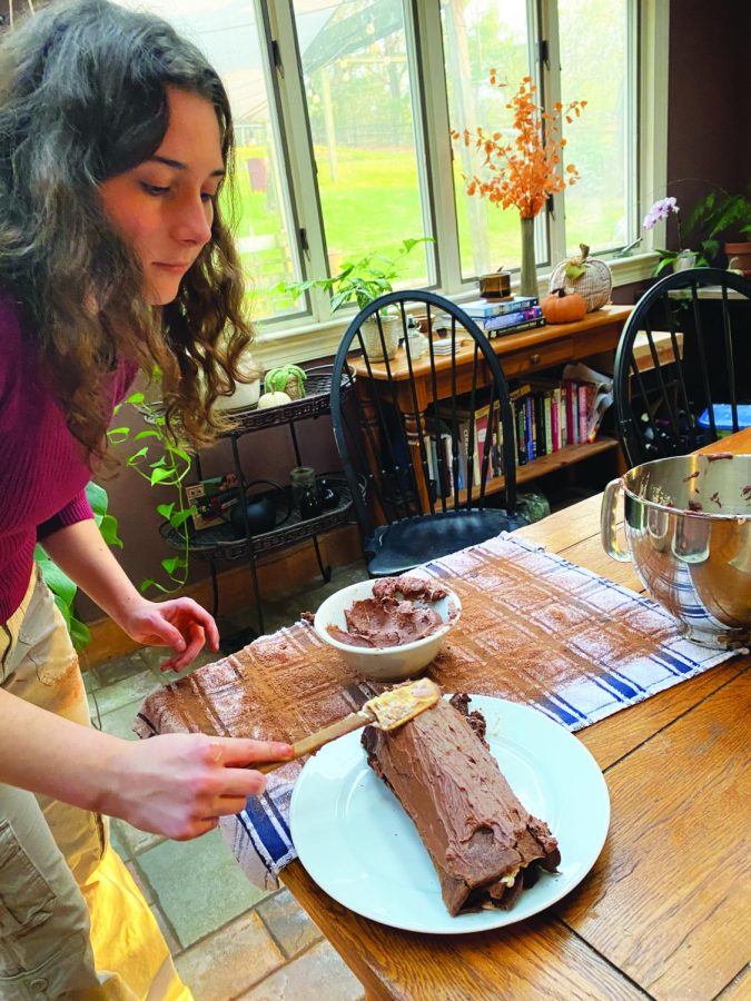 Fab‘yule’ous…Adding finishing touches to her dessert, junior Claudia Elwell prepares a yule log. The yule log was based on a recipe from Great British Baking judge Prue Leith.