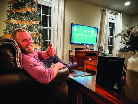 Kicking back…Reclining and relaxing, RedAlert adviser Brian Ruth enjoys watching a Christmas Hallmark movie. Ruth finds Hallmark movies to be entertaining “train wrecks.”