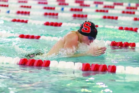 Reaching for glory…Swimming breaststroke, junior Elijah Gehman competes against Central Bucks South High School during a meet on January 6. 