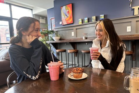 A latte love…Connecting over coffee, juniors Ava Mills (left) and Angela Trinh celebrate Galentine’s Day over pink lattes and muffins at the Broad Street Grind in Souderton.