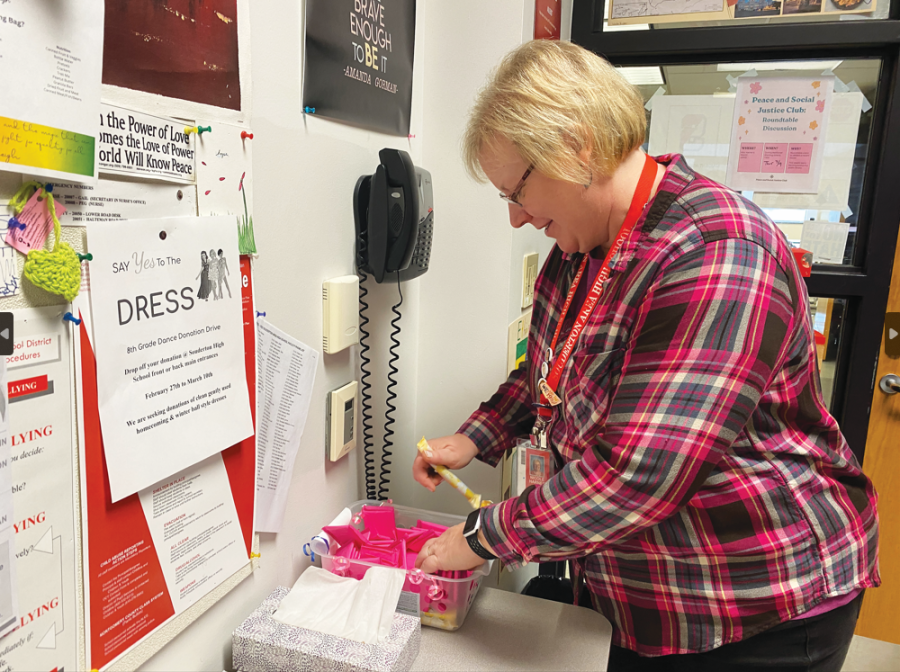 Going with the flow…Working towards change, social studies teacher Nicole Harner organizes period products in her classroom to give access for students who may need them. 