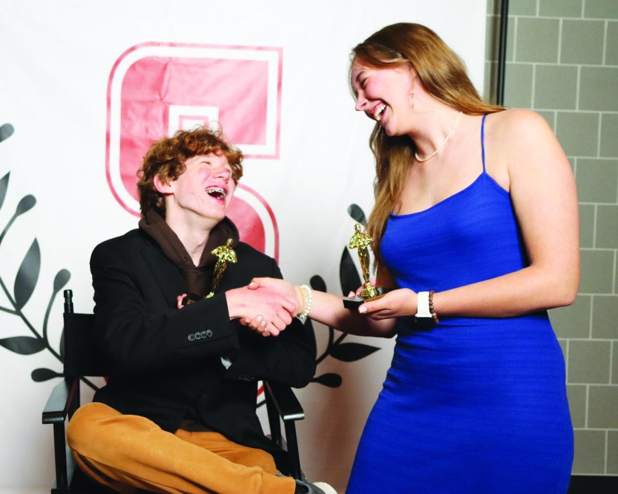 Basking+in+their+laurels%E2%80%A6Celebrating+their+film+fest+wins%2C+senior+Ally+Lemon+and+junior+Zach+Gross+share+a+laugh+on+the+red+carpet.+