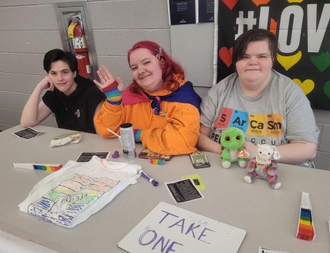 Silent support... Showing support for the LGBTQ+ community, GSA members MacKenzie Sacks, Emma FitzGerald, and Periwinkle McDowell host a table to bring awareness to Day of Silence. All three of the GSA members participated in this year’s Day of Silence.
