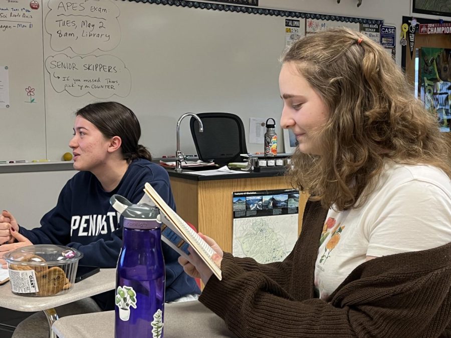 Discussing the story...Conversing during a meeting, seniors Audrey Harman (left) and Grace Lettero talk about their opinions on the book they read for April 28 meeting. 