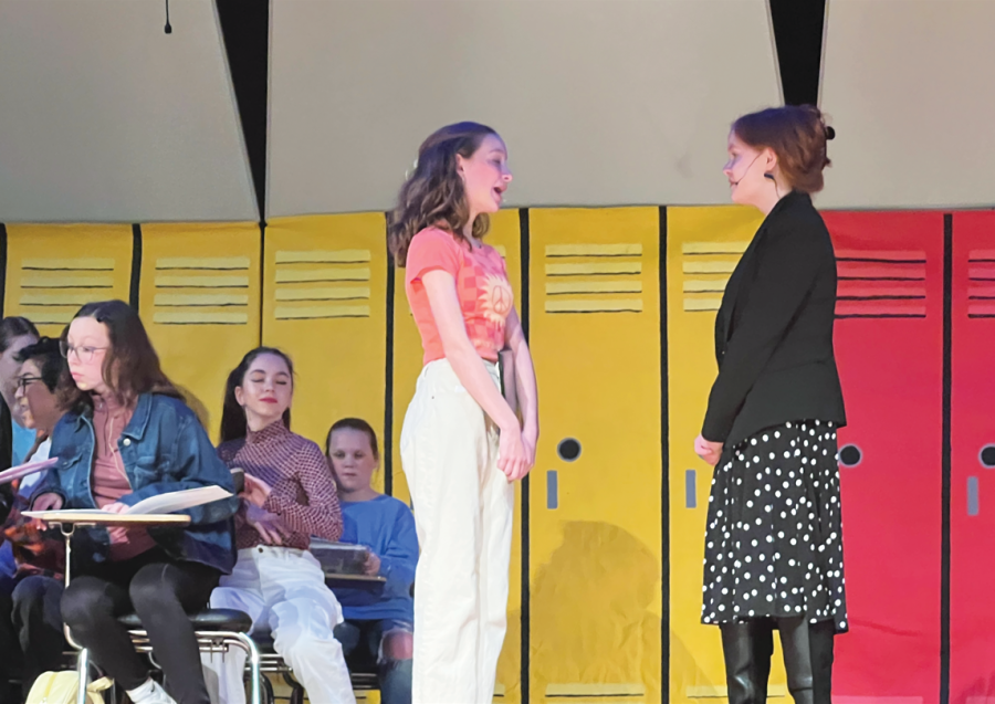 Lecturing on singing and dancing… Presenting the musical number “The Pythagorean 
Theorem” on the opening night of “Help! I’m Trapped in a Musical,” Indian Valley eighth 
graders Kendal Hoover (left) and Jessica Ulrich who played Norma LaBelle and Miss Hart, 
perform. The musical took place March 9-11.
