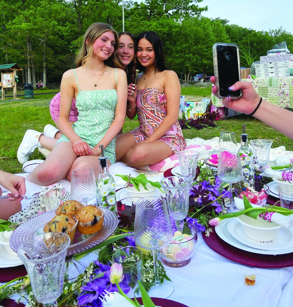 Sublime!...Celebrating girlhood, (from left) seniors Lauren Fisher, Ava Mills and Angela Trinh enjoy an outdoor picnic before going to theaters to see the Barbie movie. Warner Brothers released “Barbie” on July 21.

