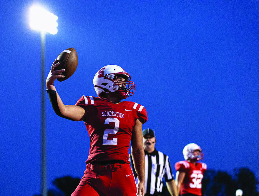 Under the lights…Touching down on a 23-21 win, captain Ryan Sadowski celebrates with the student section during a game against Central Bucks East High School on September 8. As this issue goes to press, Souderton continues their undefeated streak of  9-0.