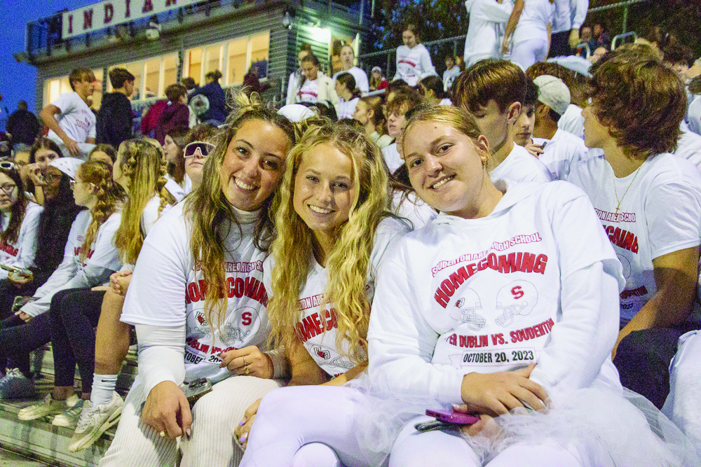 Souderton blizzard...Attending Souderton’s Homecoming football game against Upper Dublin on October 20, (from left) seniors Emily Tusman, Olivia Plinke and Makayla Mihelcic wear whiteout gear to show their school spirit.