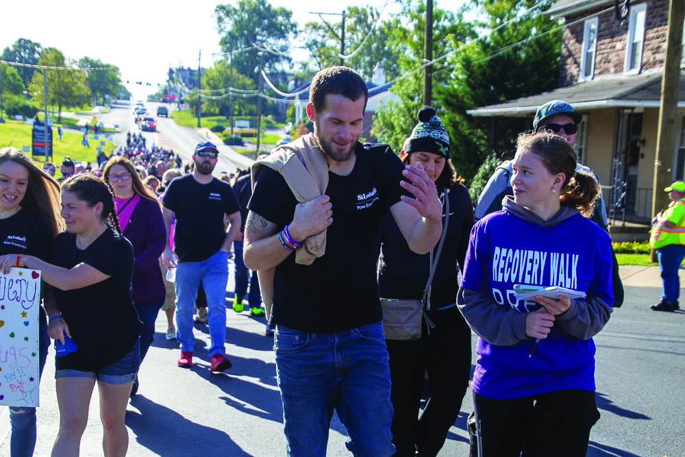 Stepping forward…Celebrating recovery within the community, Allentown resident Allen Beerhrle (left) speaks with Arrowhead Features Editor Melanie Vincent during the St. Luke’s Penn Foundation “Recovery is for Everyone Walk” on September 16. 
