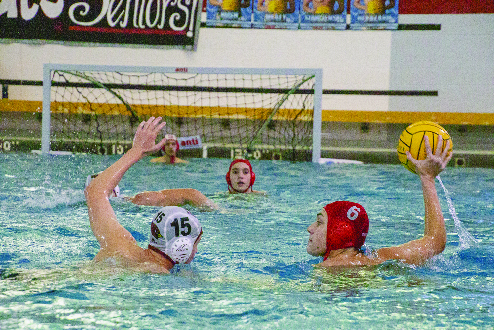 Making a splash...Competing against Upper Dublin on October 5, junior Nathan Kleppinger maintains control of the ball.