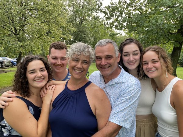 Surrounded by love...With her husband Michael to her right, science teacher Valerie Ford is embraced by her children (from left) Bekah, Jacob, Emma and Nicole.