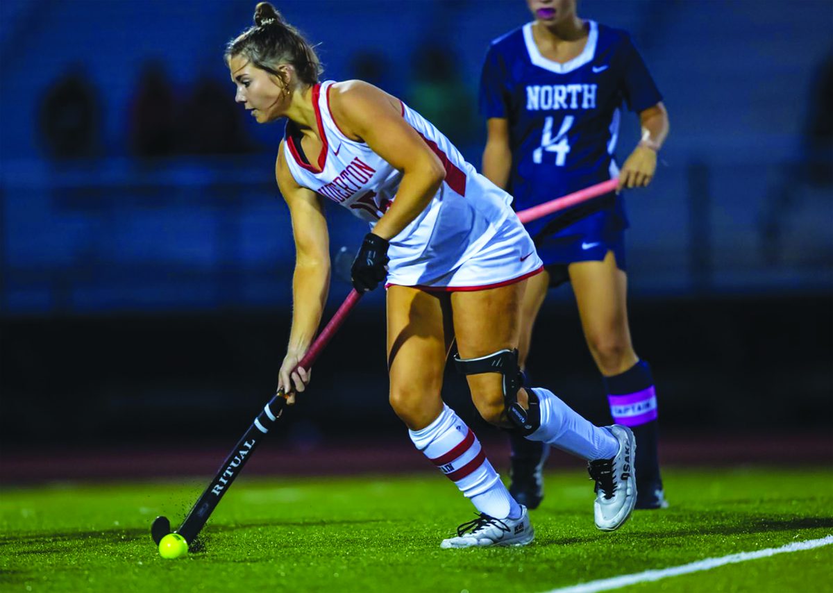 Go Bears!…Carrying the ball across the field, senior Ashley Paturzo sets the team up for success. Paturzo will continue her athletic career in field hockey playing D1 at Brown University.