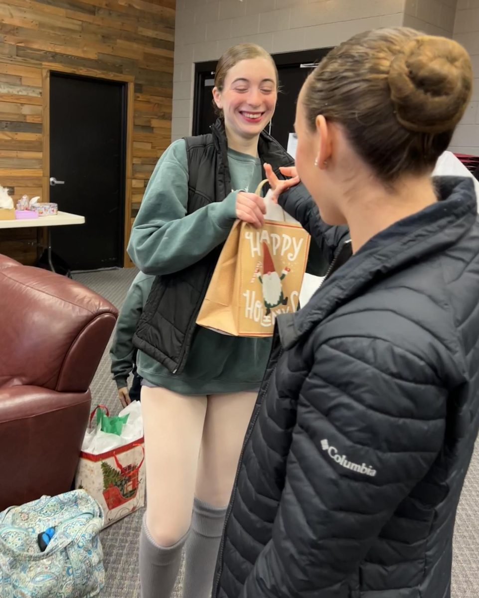 Land of gifts…Keeping with tradition, DVDA dancers Erin Malley (left) and Elise Holly exchange Pollyana gifts before their performance of “The Nutcracker” on December 2. 